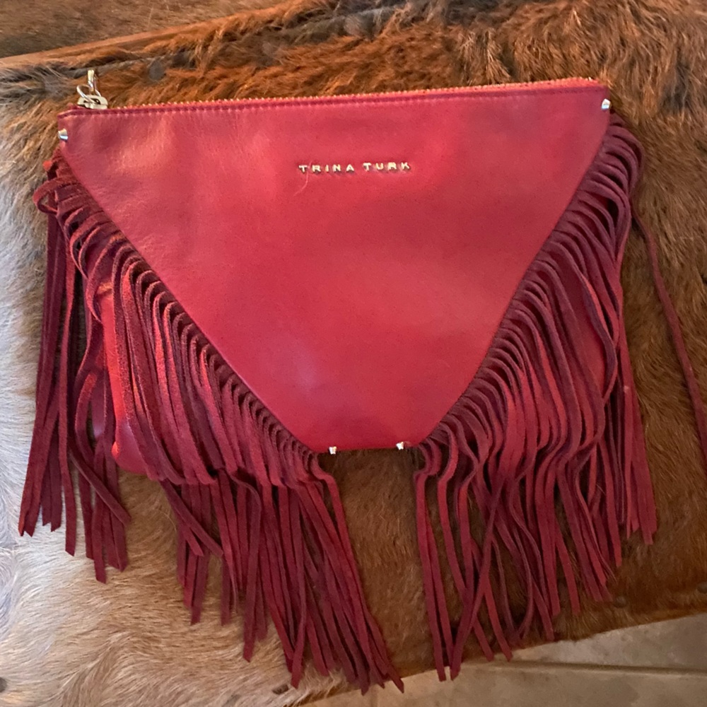 Trina Turk red leather fringe wristlet/clutch